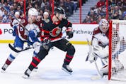  Austin Watson of the Senators battles for position with Valeri Nichushkin of the Avalanche in front of netminder Jonas Johansson during the second period.