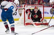 Senators goalie Mads Sogaard makes a save on a shot from Avalanche centre Evan Rodrigues in the second period of Thursday's contest.