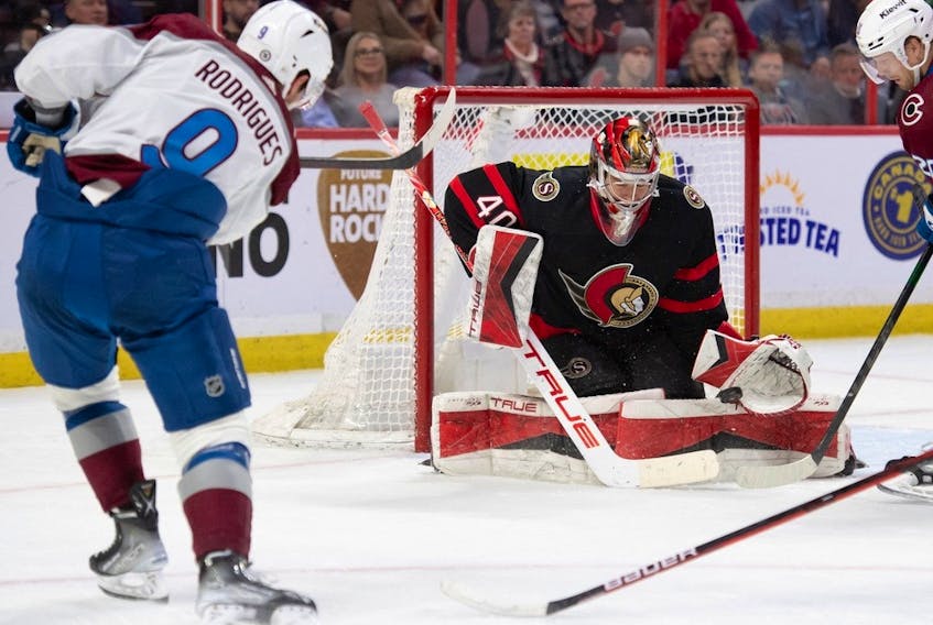 Senators goalie Mads Sogaard makes a save on a shot from Avalanche centre Evan Rodrigues in the second period of Thursday's contest.