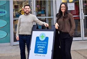 Pharmacist Colleen MacInnis and Matt MacInnis hang out the new sign promoting a primary care clinic, which is located at 157 Water St. in Shelburne. CONTRIBUTED