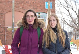 Sarah Outram, left, and Cecilia Williams, along with the advocacy arm of Fusion Charlottetown, are calling for a safe walking path along Buchannan Drive on the hill between Walmart and the HomeSense parking lot. Alison Jenkins • The Guardian