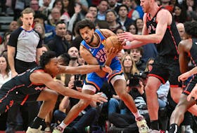 Oklahoma City Thunder forward Olivier Sarr (30) battles for the ball with Toronto Raptors forward Scottie Barnes (4) and center Jakob Poeltl (19) in the second half at Scotiabank Arena.