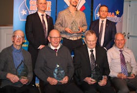 Alfred Arsenault, back right, chief operating officer of the Provincial Credit Union, helped the Acadian and Francophone Chamber of Commerce of P.E.I.’s spokesperson Pierre Gallant, back left, in presenting trophies and framed certificates to five new hall of fame inductees on March 11 during the 2023 Entrepreneurs’ Gala. Inductees and representatives from front left are Melvin Gallant, John Arsenault, representing his brother, the late Euclide Arsenault, Euclide Gallant, Ernest Arsenault and, back centre, Benjamin Gallant, representing his grandmother Jeanne Durant. Contributed