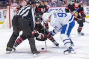 Ottawa's Claude Giroux and Toronto's John Tavares go head-to-head in the faceoff circle during the second period of Saturday's game.
