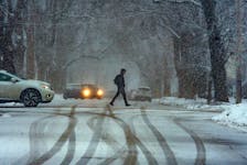 A pedestrian crosses Beech Street in west end Halifax as heavy snow begins to fall on Thursday, March 3, 2023. Ryan Taplin - The Chronicle Herald