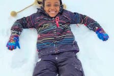 Oche Agwuchi’s daughter, Alyssa, enjoys some fun in the snow during playtime at school in New Waterford. CONTRIBUTED