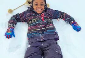 Oche Agwuchi’s daughter, Alyssa, enjoys some fun in the snow during playtime at school in New Waterford. CONTRIBUTED