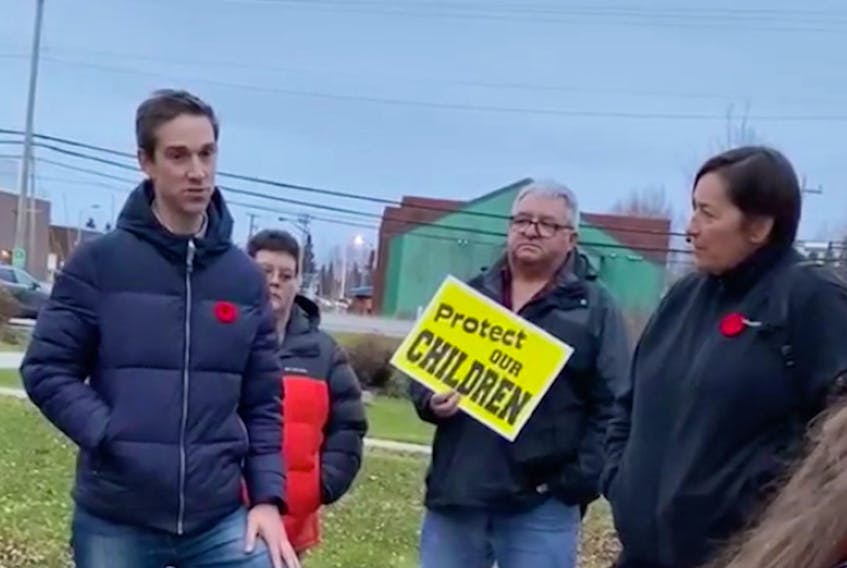 Justice Minister John Hogan talks to Happy Valley-Goose Bay residents Nov. 10 in this screenshot from a video. Looking on at right is RCMP Assistant Commissioner Jennifer Ebert. (Contributed)