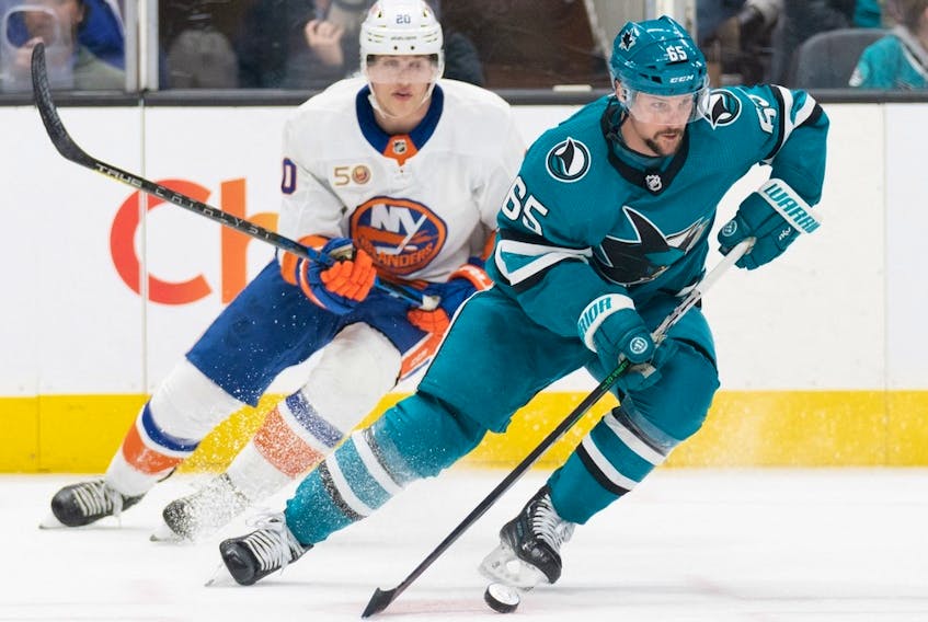 San Jose Sharks defenceman Erik Karlsson (65) controls the puck during the third period against the New York Islanders at SAP Center in San Jose, Calif., on March 18, 2023.