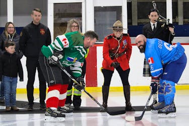 RCMP Const. Layla Fish prepares for the ceremonial puck drop between South Shore Two’s Andrew Dixon, left, and Blue Rockets Jean-Francois Desfosses March 18 during the Dave Wynn Memorial Classic hockey tournament in Lawrencetown. Dixon was Wynn’s partner when he worked as a paramedic on Nova Scotia’s South Shore.
Jason Malloy