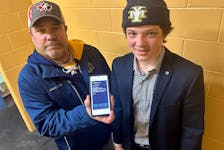 Sawyer Kristensen with his Yarmouth U15AA coach Paul MacDonald and the three-sentence reply that was originally received from Hockey Nova Scotia saying the ruling could not be overturned and the matter was closed. TINA COMEAU PHOTO