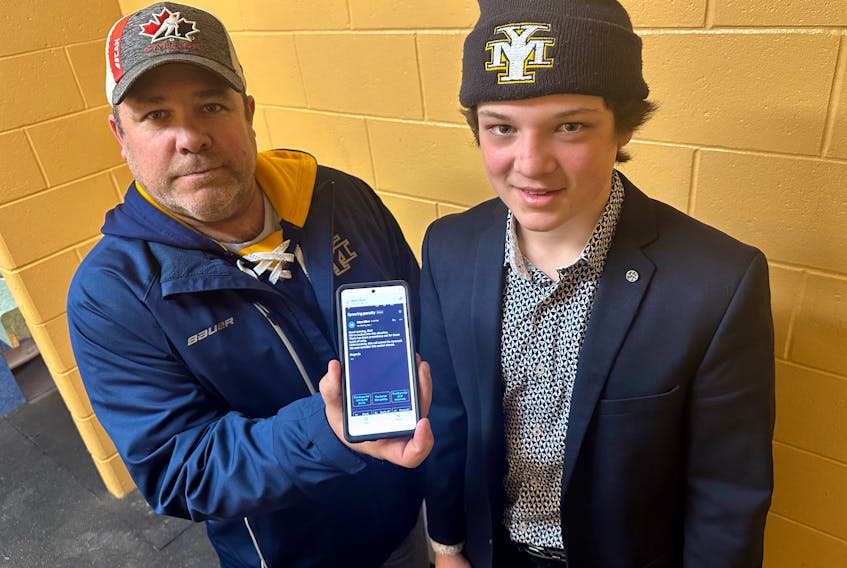 Sawyer Kristensen with his Yarmouth U15AA coach Paul MacDonald and the three-sentence reply that was originally received from Hockey Nova Scotia saying the ruling could not be overturned and the matter was closed. TINA COMEAU PHOTO