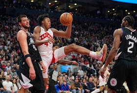 Raptors' Scottie Barnes comes down with a ball against L.A. Clippers' Ivica Zubac (40) and forward Kawhi Leonard during the first half at Scotiabank Arena on Tuesday, Dec. 27, 2022.