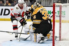 Goaltender Linus Ullmark of the Boston Bruins makes a save on shot by Alex DeBrincat of the Ottawa Senators during the second period at the TD Garden on Tuesday night.