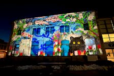 A Maud Lewis show has been projected onto the side of the Western Branch of the Art Gallery of Nova Scotia in downtown Yarmouth as part of the Yarmouth and Area Chamber of Commerce March Fest. TINA COMEAU PHOTO