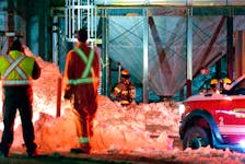 Firefighters battled a stubborn fire in a silo at an animal feed plant in Mount Pearl Tuesday night. Keith Gosse/The Telegram