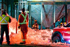 Firefighters battled a stubborn fire in a silo at an animal feed plant in Mount Pearl Tuesday night. Keith Gosse/The Telegram