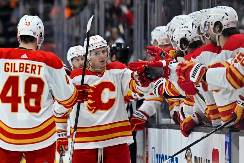 Calgary Flames defenceman Troy Stecher celebrates with teammates after scoring against the Anaheim Ducks at Honda Center in Anaheim on Tuesday, March 21, 2023.