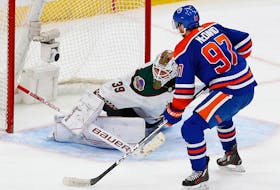 Edmonton Oilers forward Connor McDavid (97) scores the overtime winning goal, his 60th goal of the season against Arizona Coyotes goaltender Connor Ingram (39) at Rogers Place. 