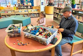 Liam MacLean and his daughter participate in the New Glasgow Library's Lego building challenge - Sarah Jordan