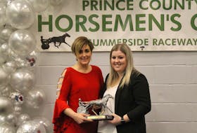Abby Clow, right, was the recipient of the Horsewoman of the Year award. Prince County Horsemen's Club director Deanna Clow, left, handed her daughter the award. Logan Plant