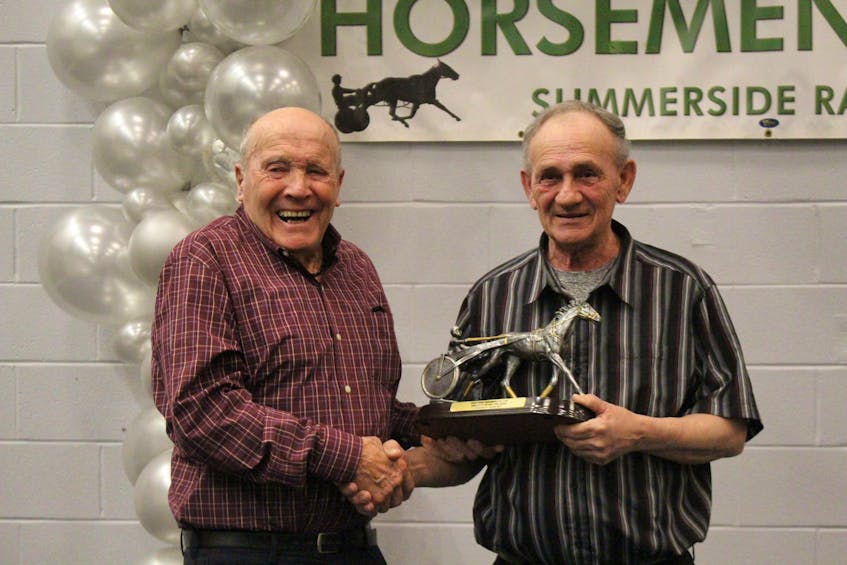 Phil Sizer, left, is the recipient for the Horseman of the Year, which was handed to him by George Riley at the annual Prince County Horsemen's Club awards banquet. Logan Plant
