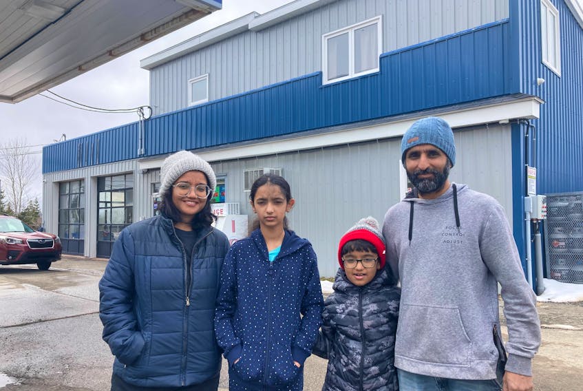 Usha, Aaryaka, Aaryaveer and Ajay Pilania at their gas station in West River, Antigonish County. Shortly after moving to the area from India to buy the gas station a sink hole collapsed their diesel tank.