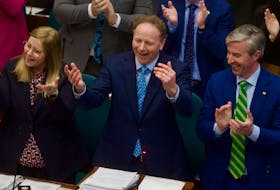 Finance Minister Allan MacMaster encourages members of the opposition to join in on the standing ovation as he delivers the budget at Province House on Thursday, March 23, 2023. Ryan Taplin - The Chronicle Herald