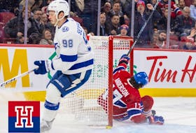 Montreal Canadiens forward Josh Anderson crashes into the net afteer being taken down by Tampa Bay Lightning's Mikhail Sergachev on March 21, 2023. Anderson left the game with an injury. 