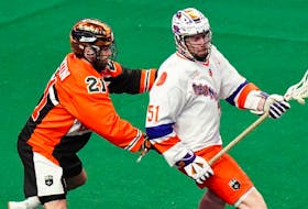 Halifax Thunderbirds forward Dawson Theede (right) batles against the defence of Justin Martin of the Buffalo Bandits during National Lacrosse League action last season in Buffalo, N.Y. - NATIONAL LACROSSE LEAGUE