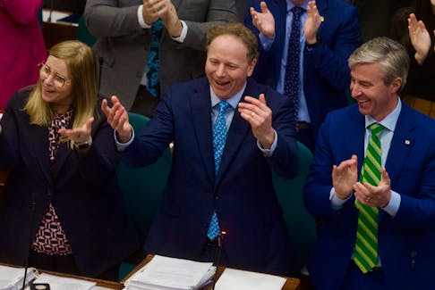 Finance Minister Allan MacMaster encourages members of the opposition to join in on the standing ovation as he delivers the budget at Province House on Thursday, March 23, 2023. Ryan Taplin - The Chronicle Herald
