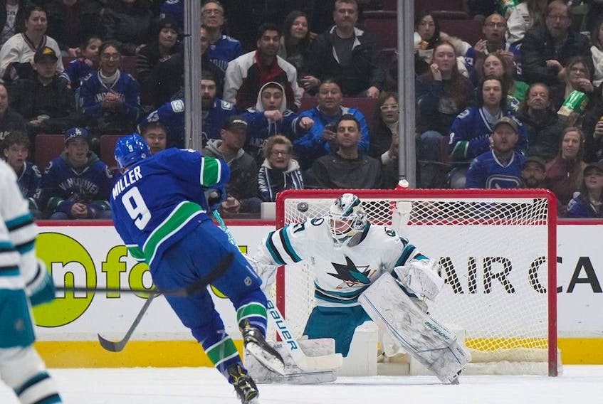  Vancouver Canucks’ J.T. Miller (9) scores against San Jose Sharks goalie James Reimer (47) during the first period at Rogers Arena on Thursday, March 23, 2023.