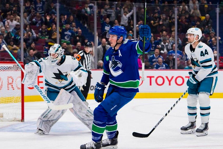 San Jose Sharks defenceman Marc-Edouard Vlasic (44) and goalie James Reimer (47) watch as Vancouver Canucks forward J.T. Miller (9) celebrates his goal in the first period at Rogers Arena.