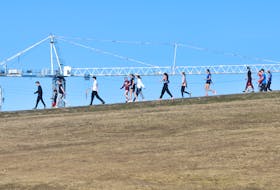 Athletes from Citadel High, warm down from doing hill sprints on said nearby hill, in Halifax Wednesday March 22, 2023

TIM KROCHAK PHOTO