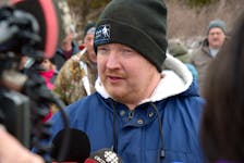 Crab fisherman Jason Sullivan speaks to reporters during a protest by crab fishermen at the DFO building in St. John’s Wednesday. Keith Gosse • The Telegram