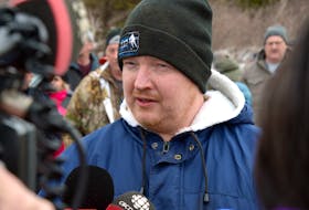 Crab fisherman Jason Sullivan speaks to reporters during a protest by crab fishermen at the DFO building in St. John’s Wednesday. Keith Gosse • The Telegram