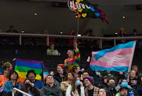 Hockey fans wave Pride flags during the Edmonton Oil Kings' Pride Night at Rogers Place, in Edmonton Friday Feb. 3, 2023. Photo By David Bloom
