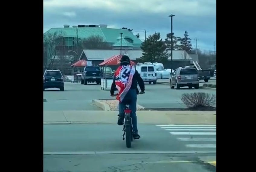 Bridgewater Police Service is investigating reports of a man riding a bicycle in the town while wearing a swastika flag on Friday, March 24. Reddit user Own-Background3394