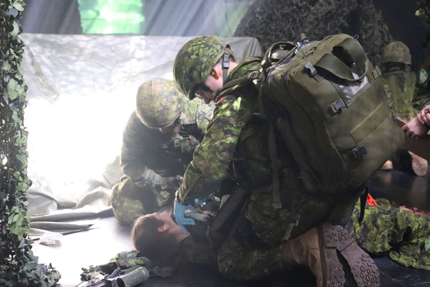Canadian Forces reservists practise “live under fire” first aid at the Queen Charlotte Armoury in Charlottetown on March 25. Logan MacLean • The Guardian