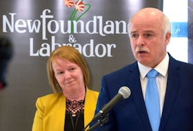 Health Minister Tom Osborne makes an announcement on staff recruitment and retention at Pleasantview Towers Monday afternoon, March 27. Looking on is Debbie Walsh, vice-president of clinical services and chief nursing officer at Eastern Health. Keith Gosse • The Telegram