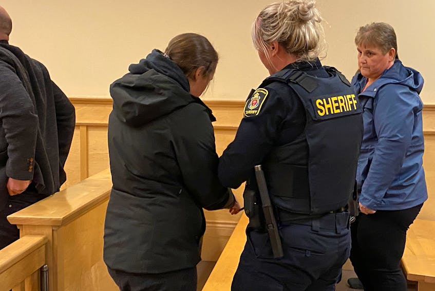 Suspended RNC officer Noelle Laite is handcuffed by a sheriff's officer after being sentenced to four months in jail in provincial court in Corner Brook on Monday, March 27. Diane Crocker • SaltWire Network