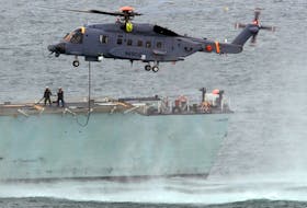 A Sikorsky CH-148 Cyclone refuels in flight off the flight deck of HMCS Montreal in Halifax Harbour in this file photo. The Montreal, supported by a Cyclone team, left for the Indian Ocean on Sunday as part of Operation Projection. - Tim Krochak