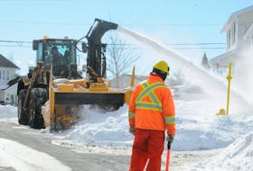 A City of St. John’s snow removal crew member spots for a snowblower operator as they conduct snow removal operations on Alderberry Lane in the Mundy Pond area of the capital city on Thursday, March 2.