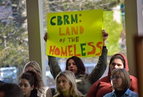 A sign of discontent from an individual attending an emergency CBRM council meeting on March 10 over the municipality rejecting $5 million in funding for affordable housing aimed at the most vulnerable. IAN NATHANSON/CAPE BRETON POST