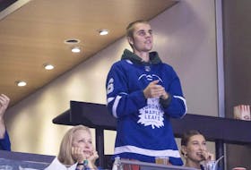 Justin Bieber watches alongside his wife Hailey Baldwin, far right, during NHL hockey action between the Philadelphia Flyers and the Toronto Maple Leafs, in Toronto on Saturday, Nov. 24, 2018. 