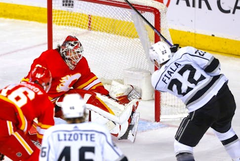 Calgary Flames goaltender Jacob Markstrom stops Los Angeles Kings forward Kevin Fiala in third-period action at the Scotiabank Saddledome in Calgary on Tuesday, March 28, 2023. 
