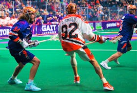 Halifax Thunderbirds defender Tyson Bell keeps his cousin Dhane Smith of the Buffalo Bandits in check during a National Lacrosse League game on March 3 at Scotiabank Centre. - TREVOR MacMILLAN / HALIFAX THUNDERBIRDS
