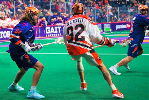 Halifax Thunderbirds defender Tyson Bell keeps his cousin Dhane Smith of the Buffalo Bandits in check during a National Lacrosse League game on March 3 at Scotiabank Centre. - TREVOR MacMILLAN / HALIFAX THUNDERBIRDS