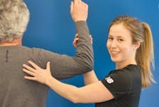 Zoomers physiotherapist Heather MacAulay checks pickleball player Frank Bensted’s shoulder mobility for muscle and joint stiffness. CONTRIBUTED