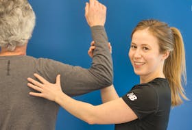 Zoomers physiotherapist Heather MacAulay checks pickleball player Frank Bensted’s shoulder mobility for muscle and joint stiffness. CONTRIBUTED